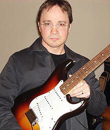 Chris Eaton with favorite guitar